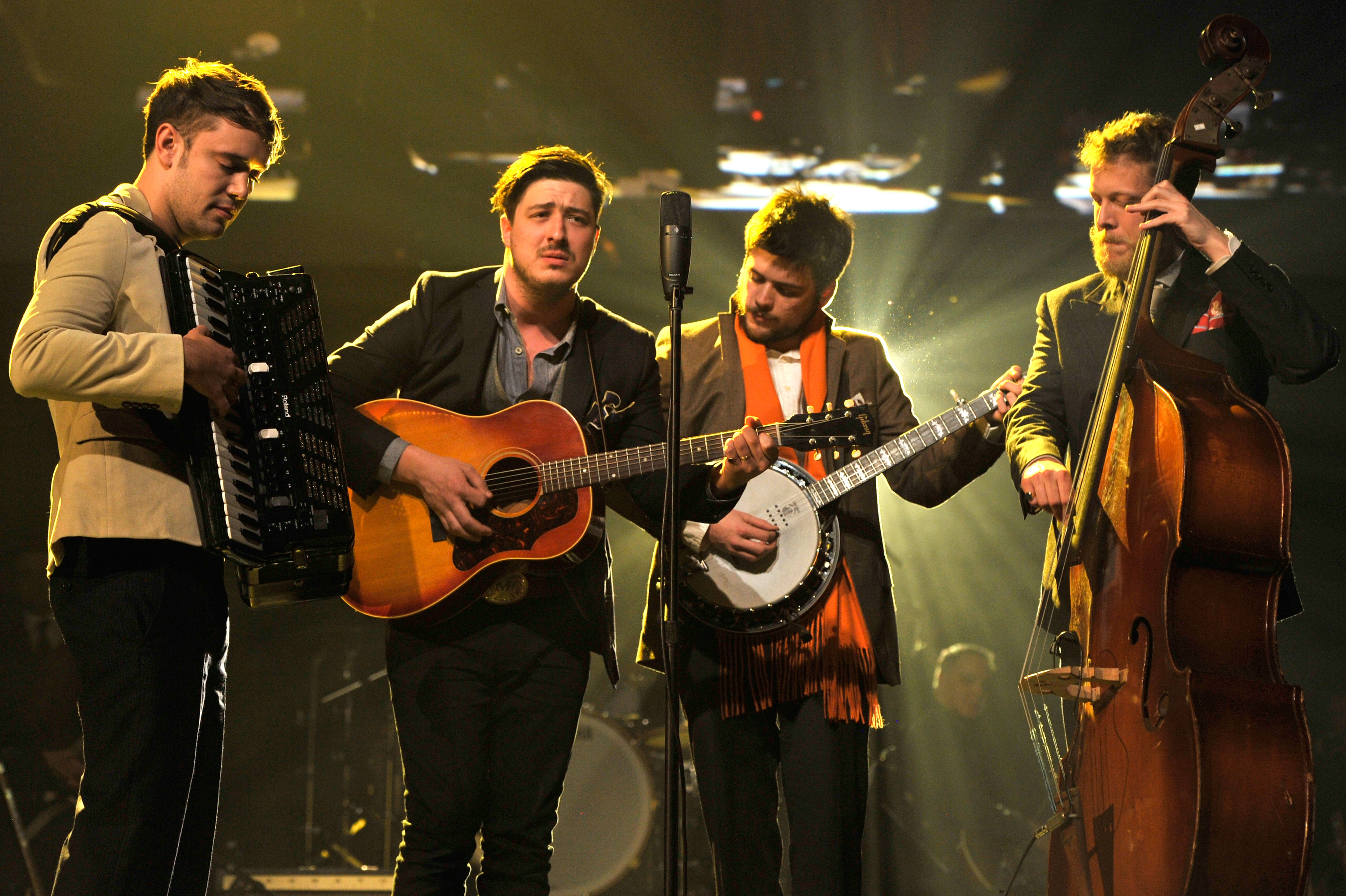 LOS ANGELES, CA - FEBRUARY 08:  (L-R) Musicians Ben Lovett, Marcus Mumford, 'Country' Winston Marshall and Ted Dwane of Mumford & Sons perform onstage at MusiCares Person Of The Year Honoring Bruce Springsteen on February 8, 2013 in Los Angeles, California.  (Photo by Larry Busacca/Getty Images for NARAS)
